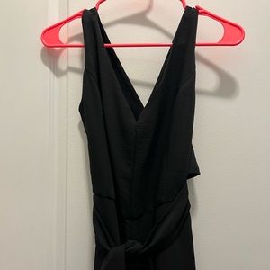 Black jumpsuit with cross back. Size large.
